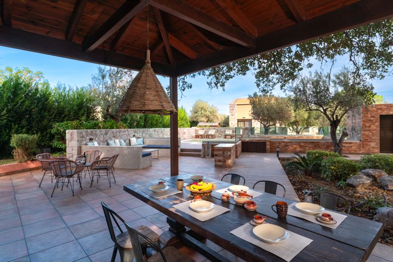 BBQ corner and lounge area by the private pool at Villa Irianna, Rhodes