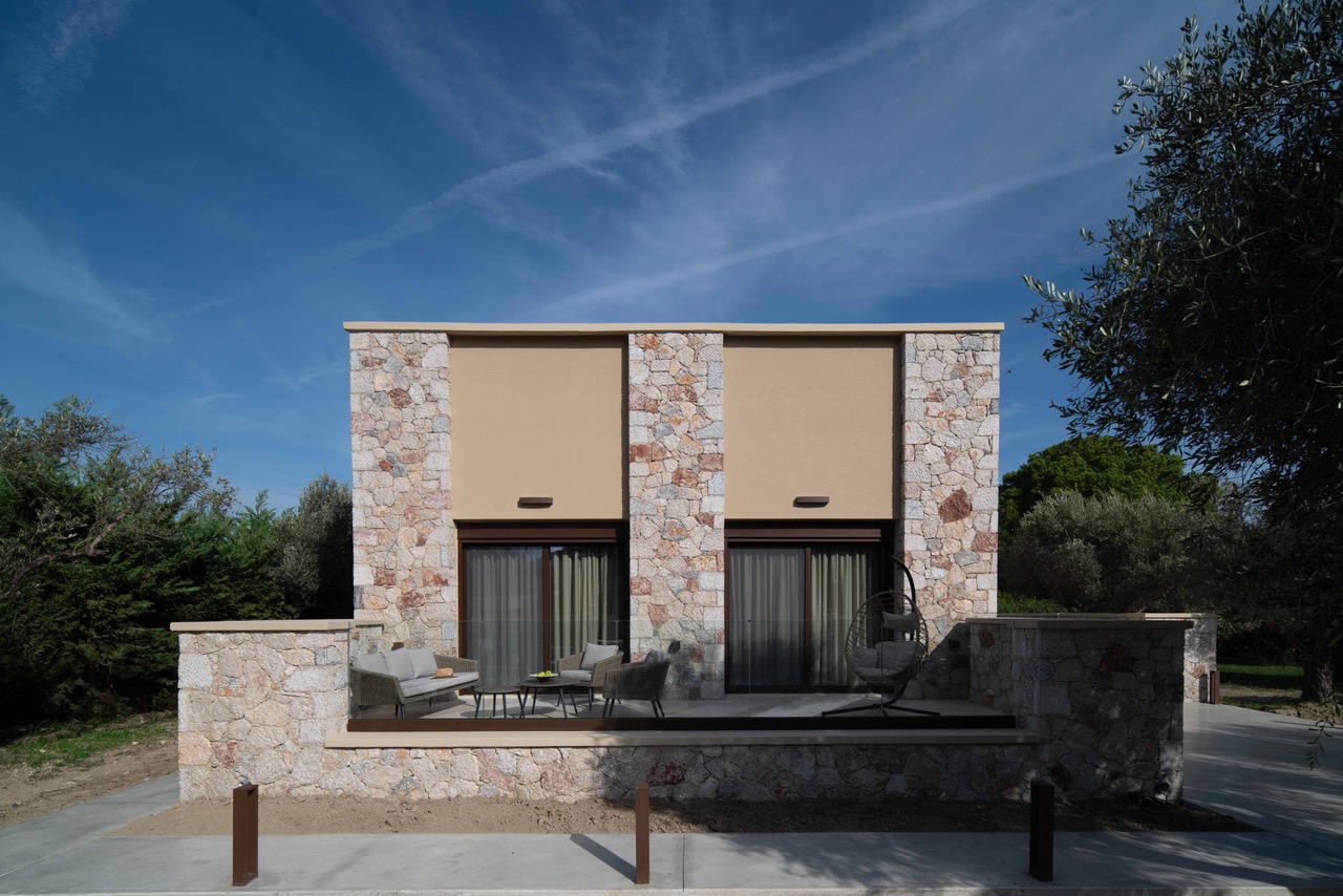 Front view of the stone villa with pool and terraces